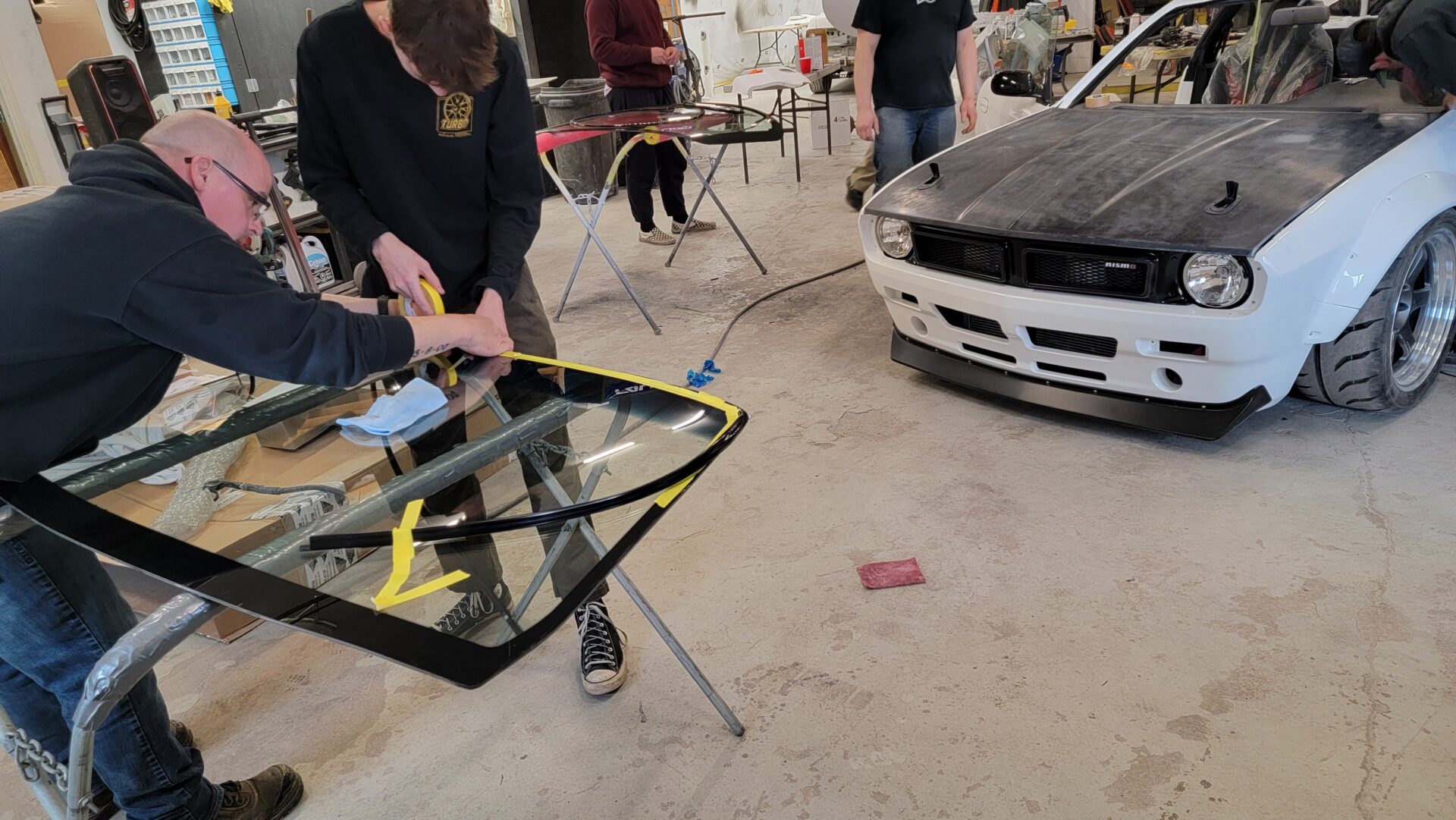 Employee prepping windshield Employee prepping windshield
